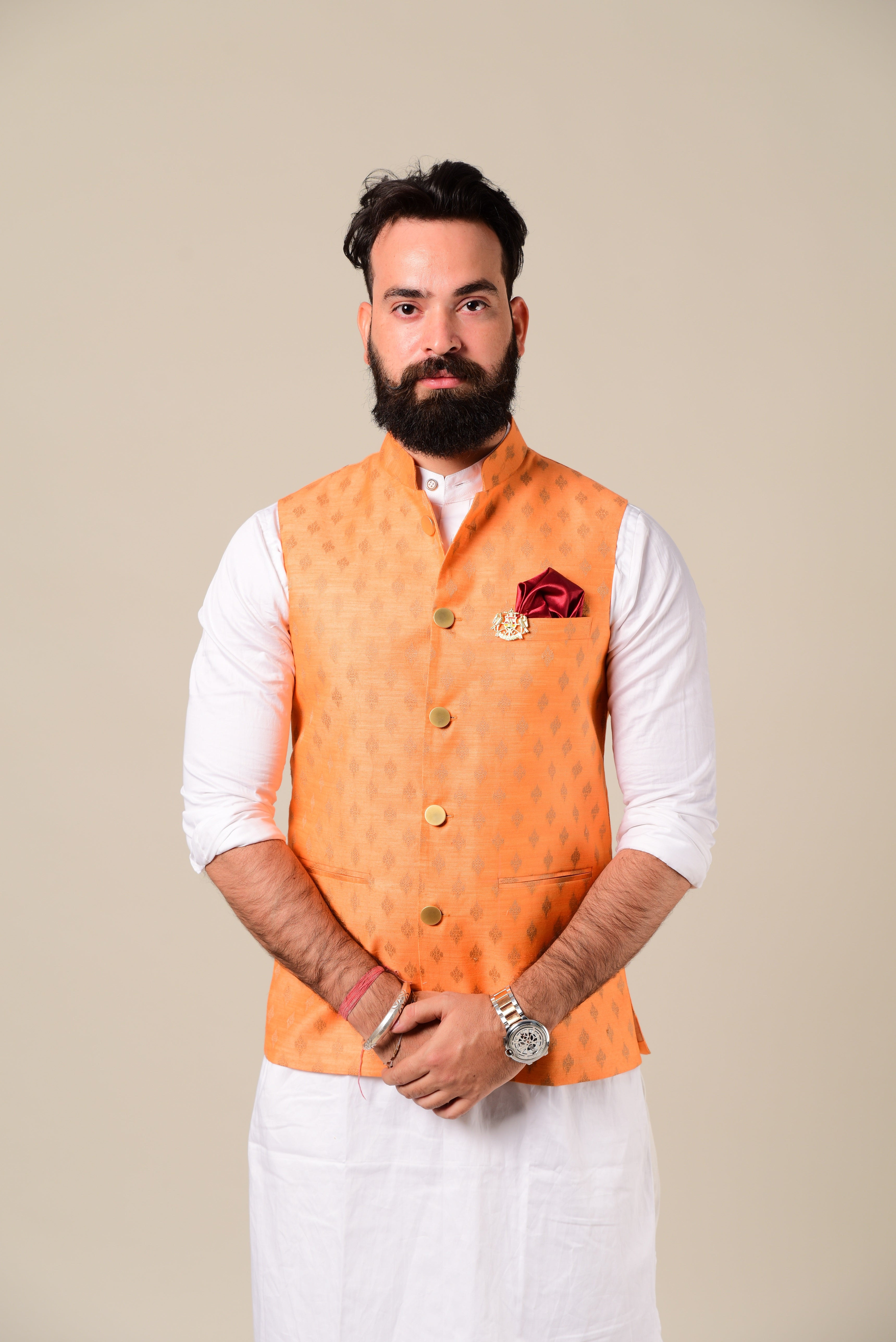 White kurta pajama top with orange jacket